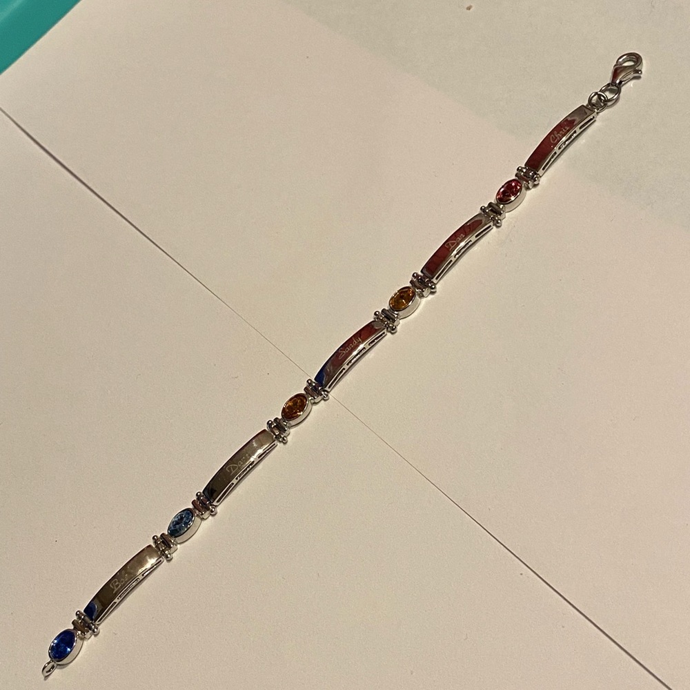 Silver tone bracelet marked 925 has names engraved on it & color stones 7.5”